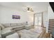 Spacious living room with L-shaped sofa and access to patio at 4822 Cane Pole Ln, Summerville, SC 29485