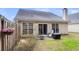 Home's back exterior, showing patio and yard at 4845 Carnoustie Ct, Summerville, SC 29485