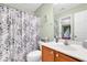 Clean bathroom with a shower/tub combo and wood vanity at 4845 Carnoustie Ct, Summerville, SC 29485