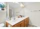 Double vanity bathroom with wood cabinets and a shower at 4845 Carnoustie Ct, Summerville, SC 29485