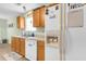 White appliances and wood cabinets in kitchen at 4845 Carnoustie Ct, Summerville, SC 29485
