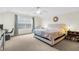 Spacious main bedroom with king-size bed and carpeted floor at 4845 Carnoustie Ct, Summerville, SC 29485