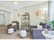 Relaxing sitting area featuring two armchairs and a stylish bookshelf at 4845 Carnoustie Ct, Summerville, SC 29485