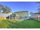 Spacious backyard with screened porch and grassy area at 5440 Overland Trl, North Charleston, SC 29420
