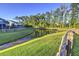 Spacious backyard with pond and wooden fence at 5440 Overland Trl, North Charleston, SC 29420
