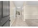Bright entryway with tile floors and view to the living room at 5440 Overland Trl, North Charleston, SC 29420