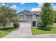 Two story house with green siding and two car garage at 5440 Overland Trl, North Charleston, SC 29420