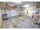 Unfinished garage with overhead storage and workbench at 5440 Overland Trl, North Charleston, SC 29420