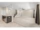 Spacious living room with carpeted floors and stairs at 5440 Overland Trl, North Charleston, SC 29420