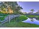 Peaceful pond-side walkway in a tranquil community at 5440 Overland Trl, North Charleston, SC 29420