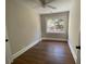Well-lit bedroom with hardwood floors and a large window at 5730 Hoover Ave, Hanahan, SC 29410