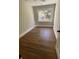 Hardwood floor bedroom with window and ceiling fan at 5730 Hoover Ave, Hanahan, SC 29410
