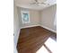 Spacious bedroom with hardwood floors and a window at 5730 Hoover Ave, Hanahan, SC 29410