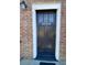 Stylish black front door with glass panels and white trim at 5730 Hoover Ave, Hanahan, SC 29410