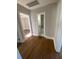 Clean hallway bathroom with hardwood floors and a tub shower combo at 5730 Hoover Ave, Hanahan, SC 29410