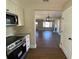Updated kitchen with stainless steel appliances and view of living room at 5730 Hoover Ave, Hanahan, SC 29410