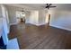 Open living room with hardwood floors and kitchen view at 5730 Hoover Ave, Hanahan, SC 29410