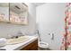 Clean bathroom with floral shower curtain and wood vanity at 601 Levee Dr, Moncks Corner, SC 29461
