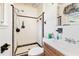 Bathroom with white tiled shower and wood vanity at 601 Levee Dr, Moncks Corner, SC 29461