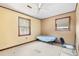 Small bedroom with single bed and window at 601 Levee Dr, Moncks Corner, SC 29461
