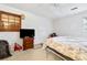 Main bedroom with window, wood dresser and neutral bedding at 601 Levee Dr, Moncks Corner, SC 29461