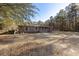 Brick ranch home with covered porch, large yard, and mature trees at 601 Levee Dr, Moncks Corner, SC 29461