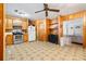 Spacious kitchen with wood cabinets, tiled floor and appliances at 601 Levee Dr, Moncks Corner, SC 29461