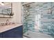 Bathroom with a walk-in shower and marble vanity at 613 Pompano St, Edisto Island, SC 29438