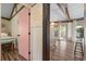 Pink door entry to bedroom with view of living area at 613 Pompano St, Edisto Island, SC 29438
