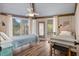 Bedroom with two twin beds, light blue bedding, and large windows at 613 Pompano St, Edisto Island, SC 29438