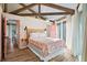 Main bedroom with a queen bed and access to a private deck at 613 Pompano St, Edisto Island, SC 29438