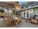 Outdoor deck features dining area, grill, and seating at 613 Pompano St, Edisto Island, SC 29438