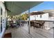 Spacious deck with dining area and umbrella at 613 Pompano St, Edisto Island, SC 29438