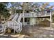 Quaint elevated beach cottage with spacious deck at 613 Pompano St, Edisto Island, SC 29438