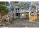 Two-story home with wrap-around decks and stairs at 613 Pompano St, Edisto Island, SC 29438