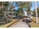 Two story home with wrap around deck, stairs and fenced yard at 613 Pompano St, Edisto Island, SC 29438