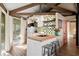 Charming kitchen boasts a green checkered backsplash and butcher block island at 613 Pompano St, Edisto Island, SC 29438