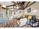 Open living area with vaulted ceilings and hardwood floors at 613 Pompano St, Edisto Island, SC 29438