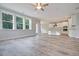 Open living space with hardwood floors and views into the kitchen area at 6522 Beagle Club Rd, Meggett, SC 29449
