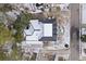 Aerial view of a house with snow-covered roof and yard at 7003 Old Landing Dr, Hanahan, SC 29410