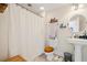 Bathroom with shower, toilet and pedestal sink at 7003 Old Landing Dr, Hanahan, SC 29410