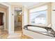 Luxurious bathroom with soaking tub, walk-in shower, and granite vanity at 7003 Old Landing Dr, Hanahan, SC 29410