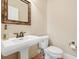 Small bathroom with pedestal sink and toilet at 7003 Old Landing Dr, Hanahan, SC 29410