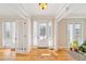 Sunlit entryway with hardwood floors and French doors leading to the outdoors at 7003 Old Landing Dr, Hanahan, SC 29410