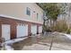 Three-car garage with additional storage space and brick exterior at 7003 Old Landing Dr, Hanahan, SC 29410