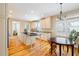 Spacious kitchen featuring granite countertops, stainless steel appliances, and hardwood floors at 7003 Old Landing Dr, Hanahan, SC 29410