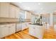 Island kitchen with granite countertops, and hardwood floors at 7003 Old Landing Dr, Hanahan, SC 29410