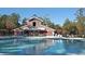 Community pool with a charming red barn-style clubhouse in the background at 7003 Old Landing Dr, Hanahan, SC 29410