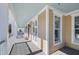Charming covered porch with light blue ceiling and gray deck at 7003 Old Landing Dr, Hanahan, SC 29410