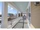 Spacious covered porch with white railings and a view of the neighborhood at 7003 Old Landing Dr, Hanahan, SC 29410